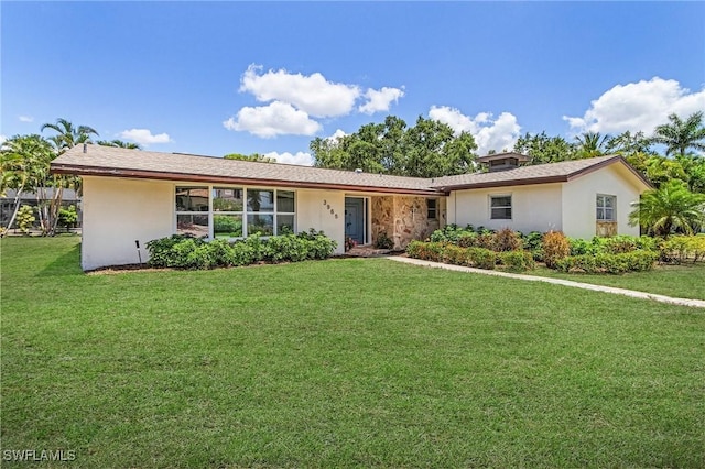 3965 W Riverside Dr, Fort Myers, FL 33901 - ranch-style house with a front lawn and stucco siding