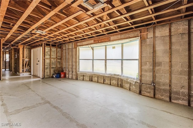 3965 W Riverside Dr, Fort Myers, FL 33901 - misc room with unfinished concrete floors and healthy amount of natural light