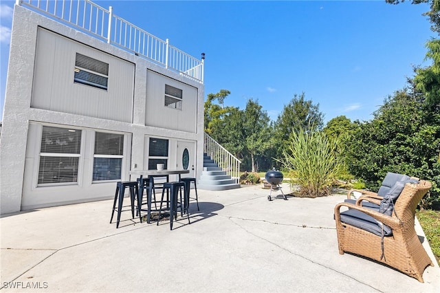 1330 Rock Rd, Naples, FL 34120 - view of patio / terrace featuring stairs and outdoor dining area