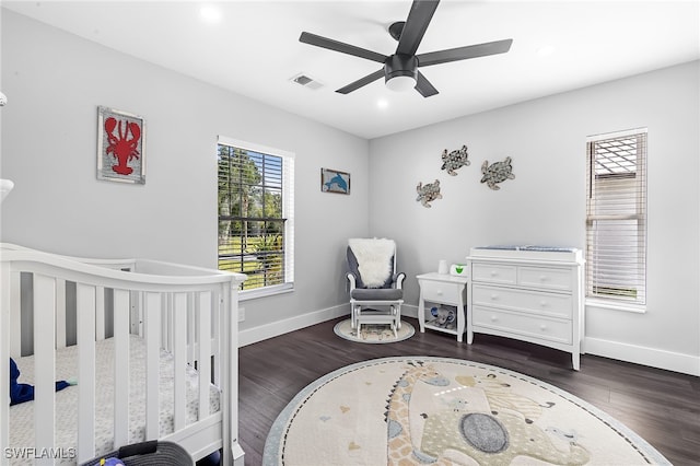 1330 Rock Rd, Naples, FL 34120 - bedroom featuring a nursery area, baseboards, visible vents, and wood finished floors