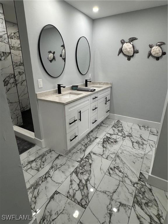 1330 Rock Rd, Naples, FL 34120 - full bathroom with double vanity, a sink, baseboards, marble finish floor, and recessed lighting