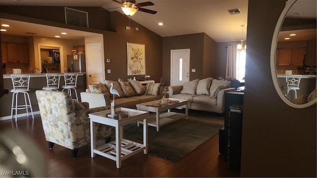 living area with ceiling fan, vaulted ceiling, dark wood-type flooring, and recessed lighting
