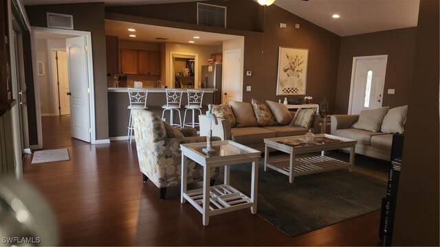 living room with dark wood-style flooring, recessed lighting, baseboards, and high vaulted ceiling