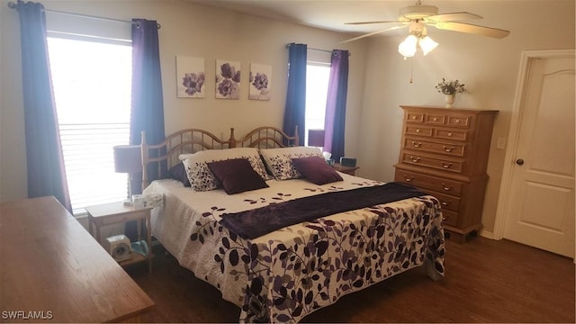 bedroom featuring dark wood-style floors and a ceiling fan