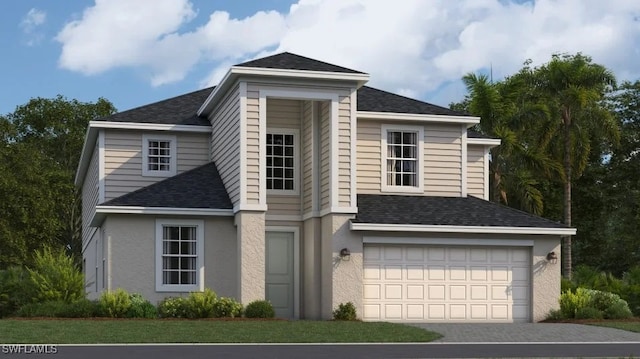 traditional home with a garage, stucco siding, driveway, and a shingled roof