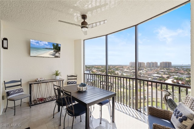 5793 Cape Harbour Dr Unit 1111, Cape Coral, FL 33914 - sunroom featuring a city view and a ceiling fan