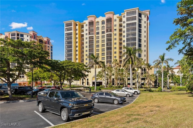 5793 Cape Harbour Dr Unit 1111, Cape Coral, FL 33914 - view of building exterior featuring uncovered parking