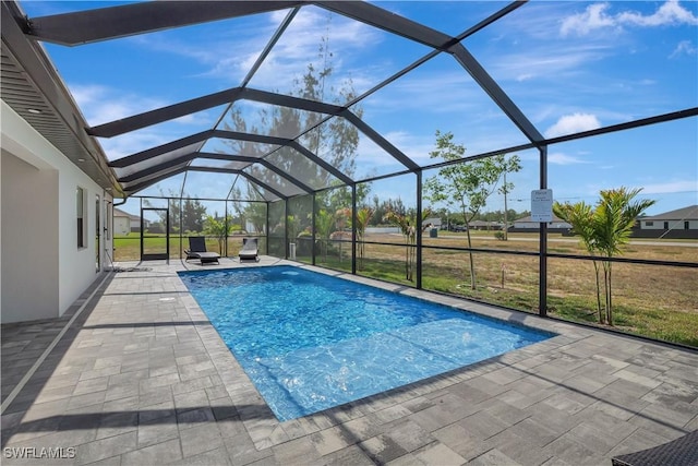 outdoor pool with a patio area and a lanai
