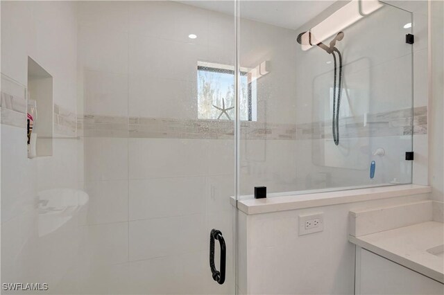 full bath featuring a shower stall and vanity