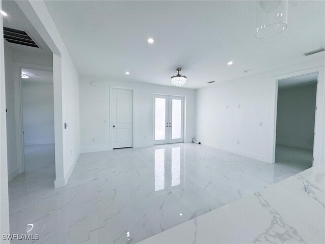 2619 15th St SW, Lehigh Acres, FL 33976 - unfurnished room with french doors, marble finish floor, recessed lighting, baseboards, and visible vents