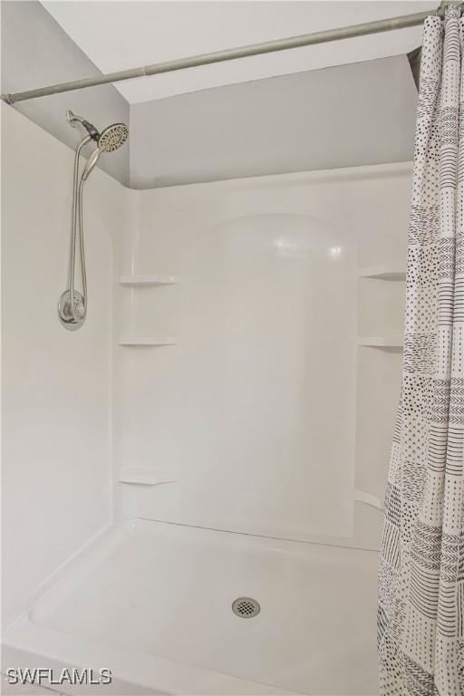 bathroom with a shower with shower curtain