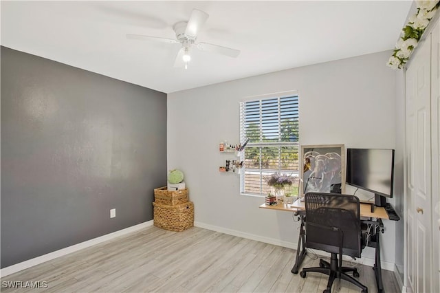 home office featuring wood finished floors, ceiling fan, and baseboards