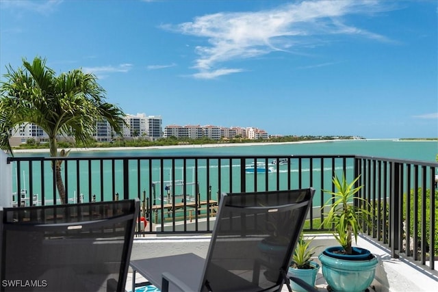 balcony featuring a water view