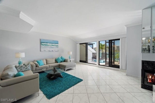 living area featuring crown molding, a high end fireplace, baseboards, and visible vents