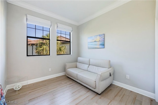 15102 Palmer Lake Cir Unit 201, Naples, FL 34109 - sitting room with light wood-type flooring, baseboards, and ornamental molding