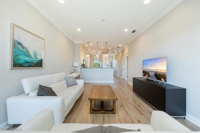 15102 Palmer Lake Cir Unit 201, Naples, FL 34109 - living room featuring recessed lighting, crown molding, light wood-type flooring, and baseboards
