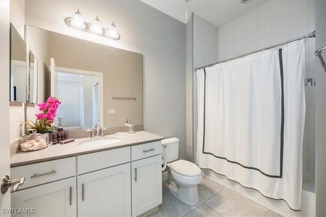 15102 Palmer Lake Cir Unit 201, Naples, FL 34109 - bathroom with tile patterned flooring, toilet, and vanity
