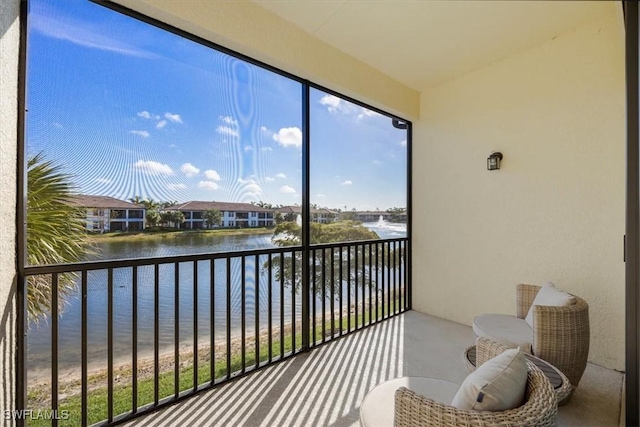 15102 Palmer Lake Cir Unit 201, Naples, FL 34109 - sunroom with a water view and healthy amount of natural light