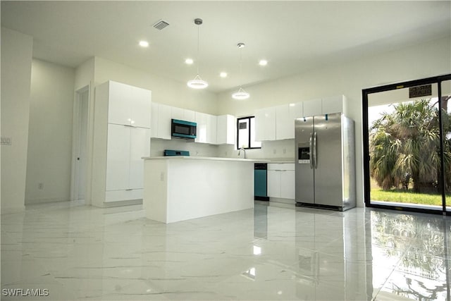 2808 NW 21st Ave, Cape Coral, FL 33993 - kitchen featuring visible vents, marble finish floor, a kitchen island, white cabinetry, and appliances with stainless steel finishes