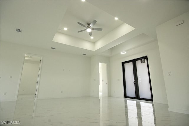 2808 NW 21st Ave, Cape Coral, FL 33993 - empty room featuring a ceiling fan, french doors, visible vents, a raised ceiling, and recessed lighting