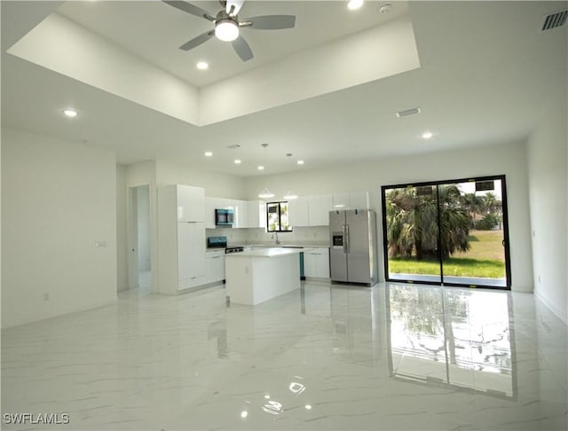 2808 NW 21st Ave, Cape Coral, FL 33993 - kitchen with marble finish floor, stainless steel appliances, recessed lighting, white cabinetry, and visible vents