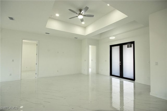 2808 NW 21st Ave, Cape Coral, FL 33993 - unfurnished room with ceiling fan, visible vents, marble finish floor, a tray ceiling, and recessed lighting