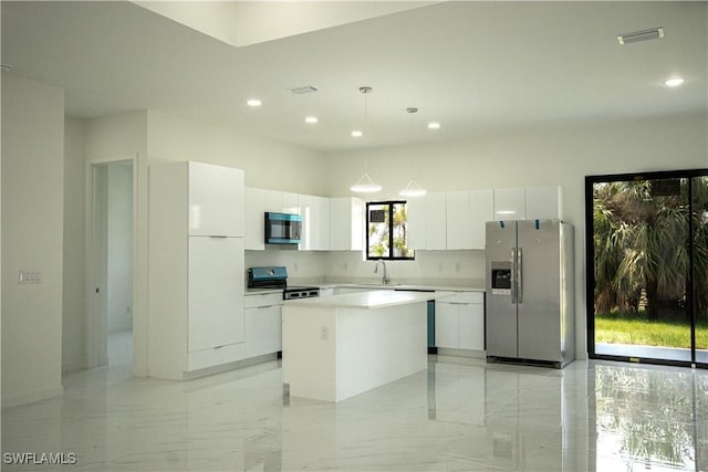 2808 NW 21st Ave, Cape Coral, FL 33993 - kitchen featuring modern cabinets, a kitchen island, stainless steel appliances, and white cabinets