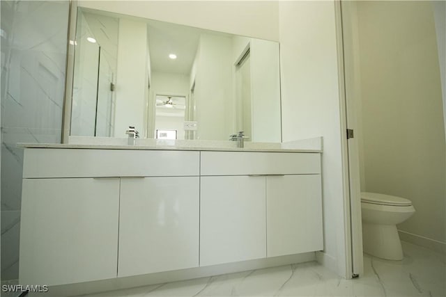 2808 NW 21st Ave, Cape Coral, FL 33993 - bathroom featuring double vanity, marble finish floor, toilet, baseboards, and a sink