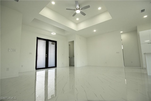2808 NW 21st Ave, Cape Coral, FL 33993 - spare room with a raised ceiling, a ceiling fan, recessed lighting, and marble finish floor