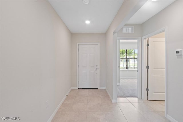 16044 Enclaves Cove Dr, North Fort Myers, FL 33917 - hall featuring light tile patterned floors, baseboards, and visible vents