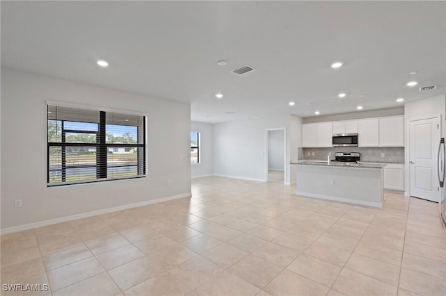16044 Enclaves Cove Dr, North Fort Myers, FL 33917 - kitchen with visible vents, baseboards, open floor plan, recessed lighting, and stainless steel appliances