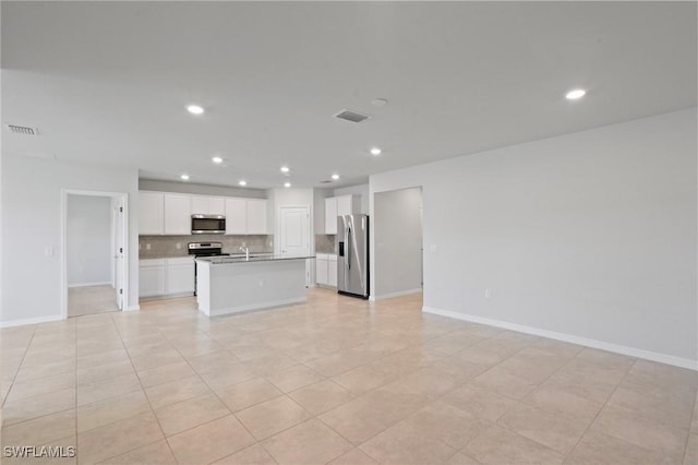 16044 Enclaves Cove Dr, North Fort Myers, FL 33917 - unfurnished living room with baseboards, recessed lighting, and visible vents