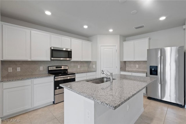 16044 Enclaves Cove Dr, North Fort Myers, FL 33917 - kitchen featuring white cabinets, appliances with stainless steel finishes, a sink, light tile patterned floors, and visible vents