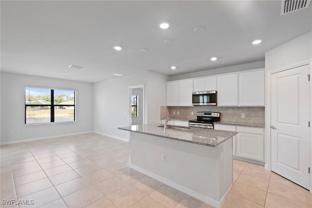 16044 Enclaves Cove Dr, North Fort Myers, FL 33917 - kitchen with visible vents, light tile patterned flooring, tasteful backsplash, a sink, and stainless steel appliances