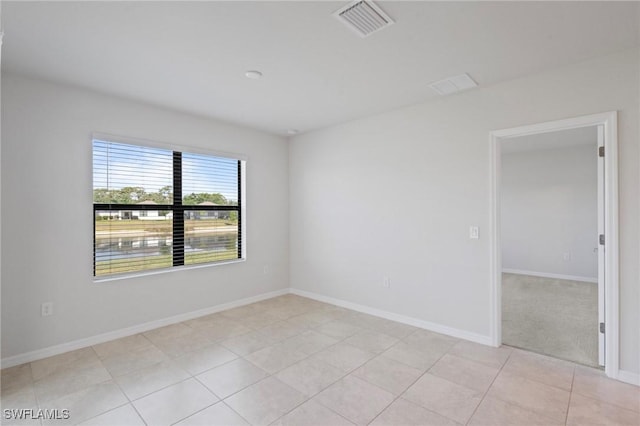 16044 Enclaves Cove Dr, North Fort Myers, FL 33917 - unfurnished room featuring light tile patterned floors, baseboards, and visible vents