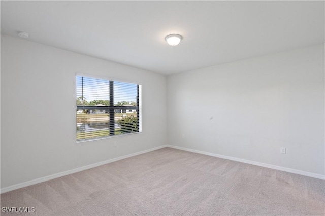 16044 Enclaves Cove Dr, North Fort Myers, FL 33917 - spare room featuring light colored carpet and baseboards