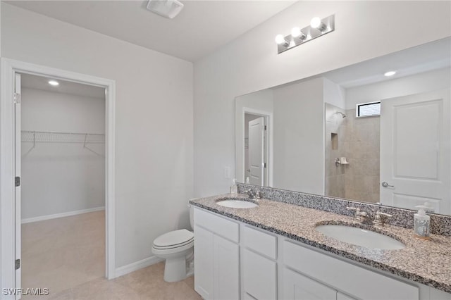 16044 Enclaves Cove Dr, North Fort Myers, FL 33917 - bathroom with a sink, toilet, double vanity, and a spacious closet