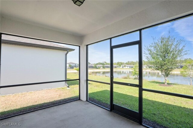 16044 Enclaves Cove Dr, North Fort Myers, FL 33917 - unfurnished sunroom with a water view and plenty of natural light