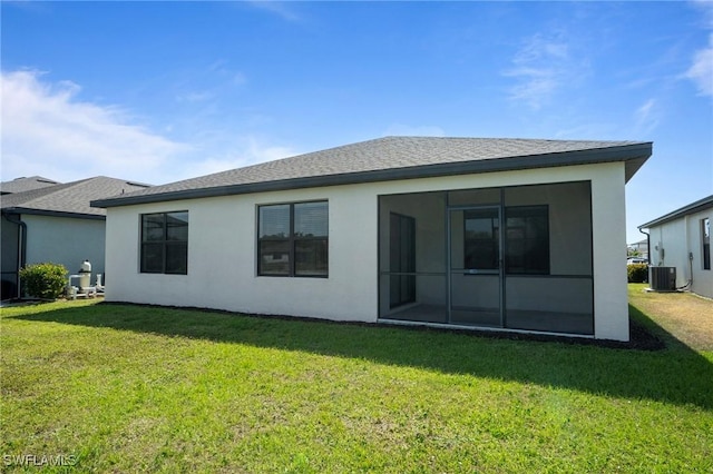 16044 Enclaves Cove Dr, North Fort Myers, FL 33917 - back of house with a lawn, central AC unit, stucco siding, and a sunroom