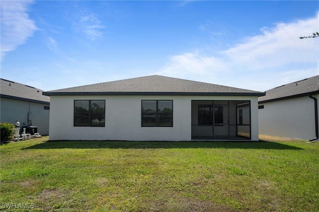 16044 Enclaves Cove Dr, North Fort Myers, FL 33917 - back of house featuring a sunroom, stucco siding, and a yard