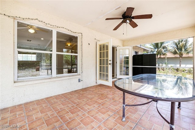 view of patio / terrace with a ceiling fan and visible vents