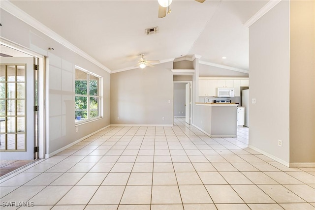 unfurnished living room with vaulted ceiling, visible vents, light tile patterned flooring, and ceiling fan