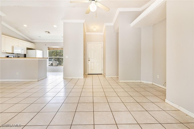 unfurnished room with light tile patterned floors, a ceiling fan, crown molding, visible vents, and baseboards