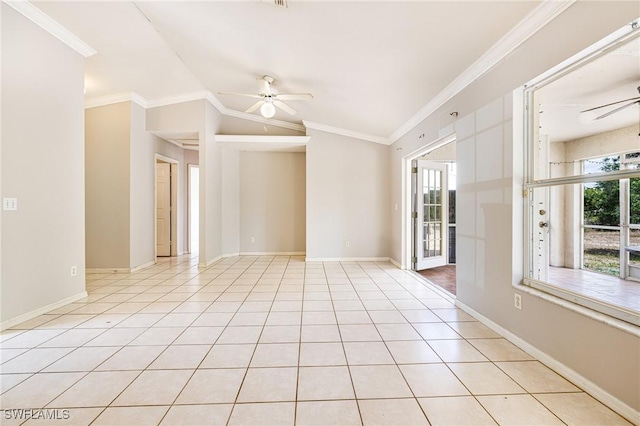 unfurnished room featuring lofted ceiling, ornamental molding, baseboards, and a ceiling fan