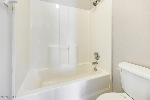 full bathroom featuring toilet and shower / bathing tub combination