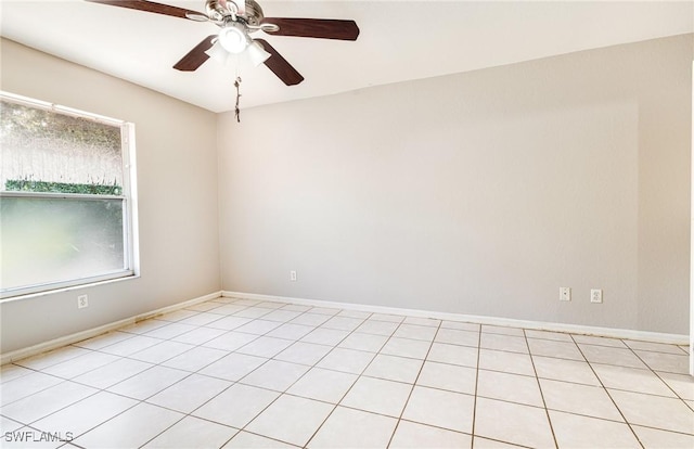 empty room featuring baseboards and a ceiling fan