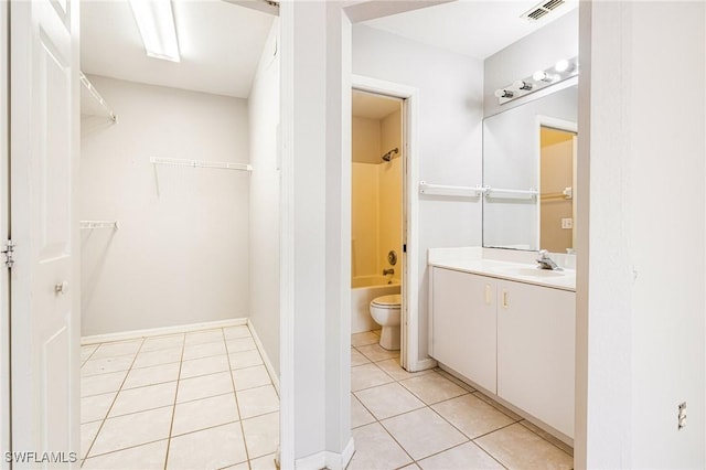 bathroom with toilet, visible vents, tile patterned floors, vanity, and bathing tub / shower combination