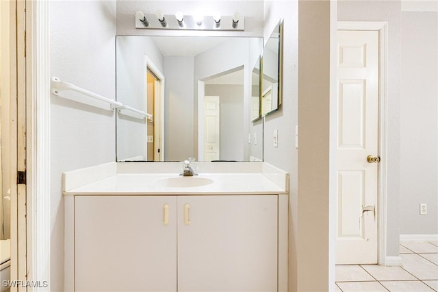 bathroom featuring tile patterned flooring and vanity