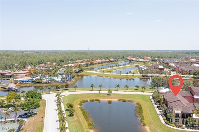 drone / aerial view featuring a residential view and a water view