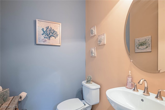 bathroom with a sink and toilet